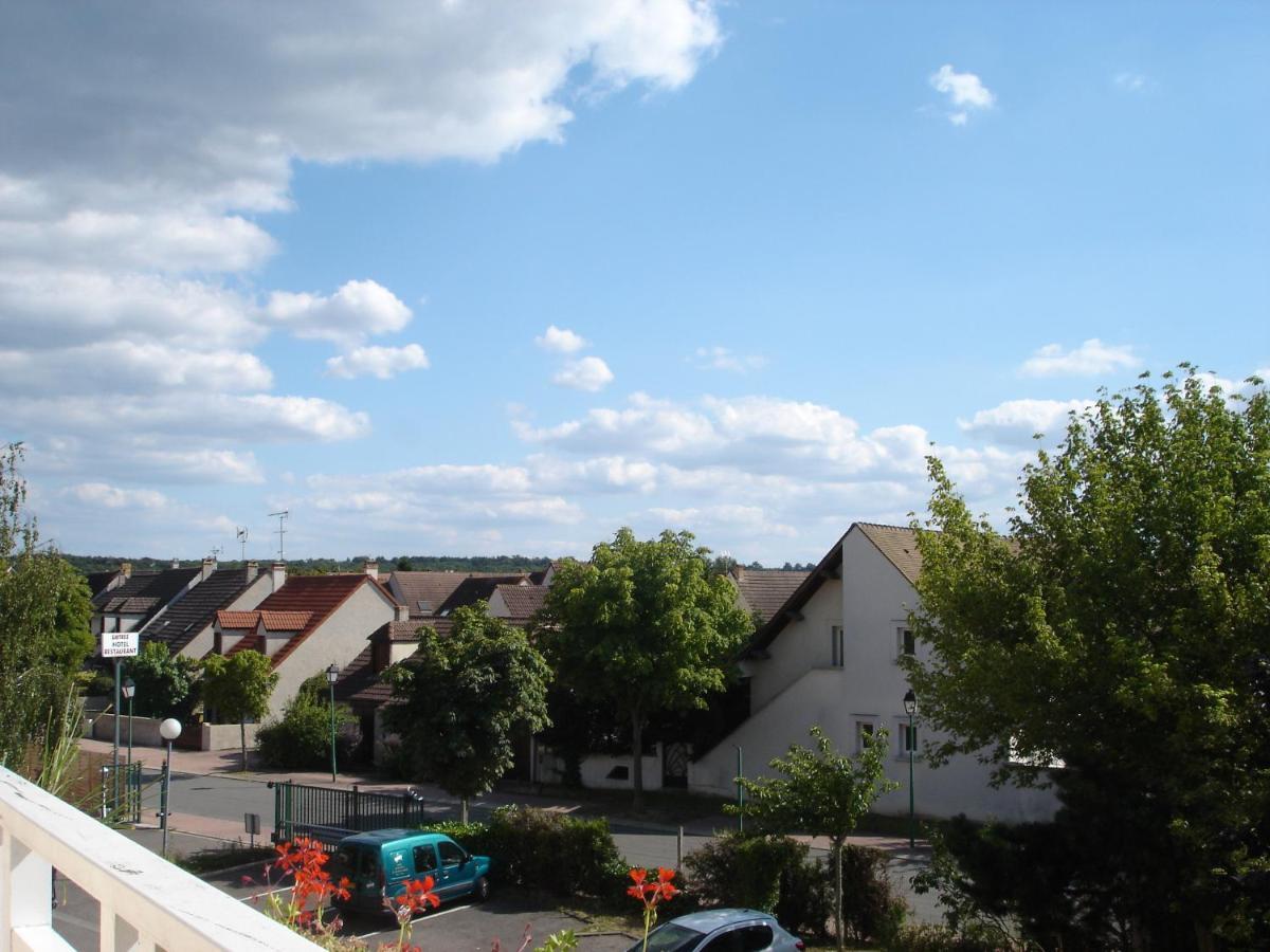 Kyriad Direct Acheres Exterior photo